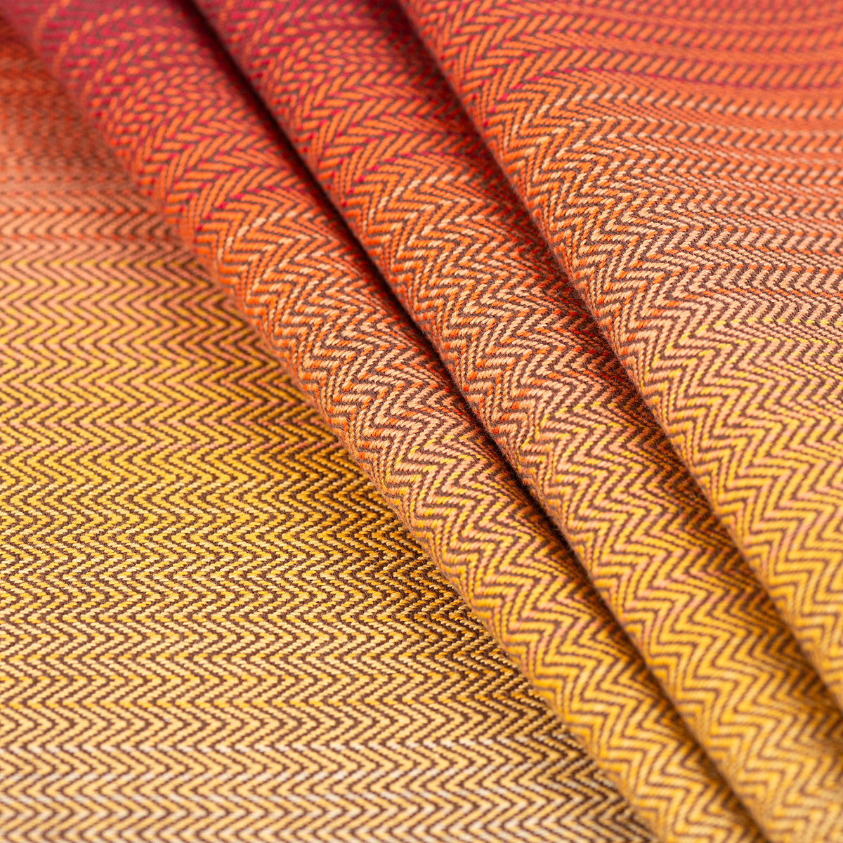 Tragetuch Solstice Fire, Girasol Fischgrat Detail gelb orange